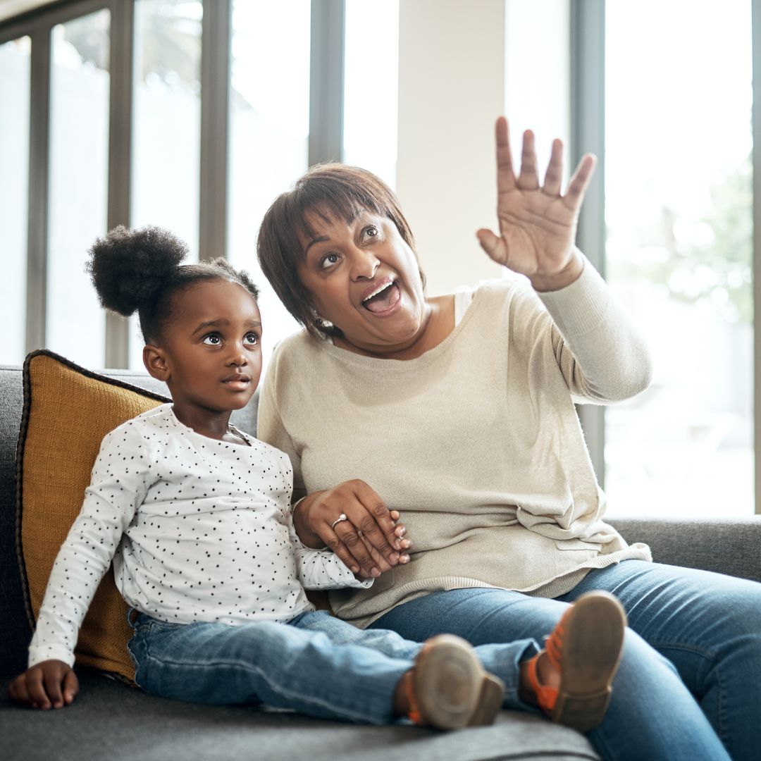 mom telling a story to a little girl
