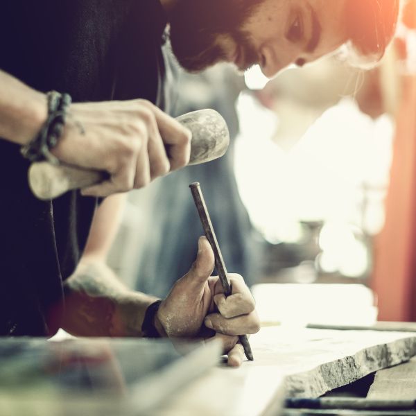 Stonecarver working with marble