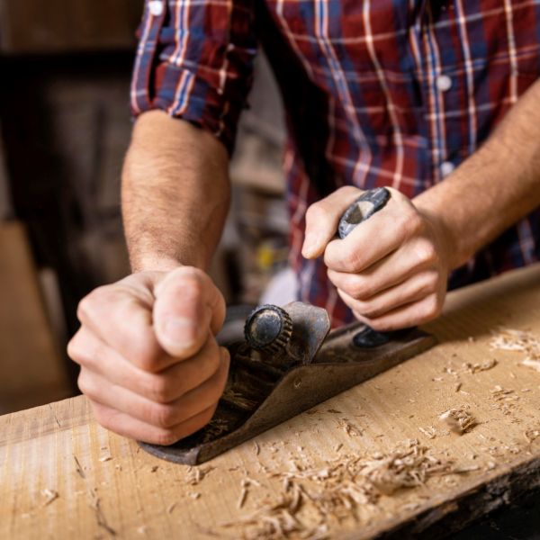 Wood carver planing wood